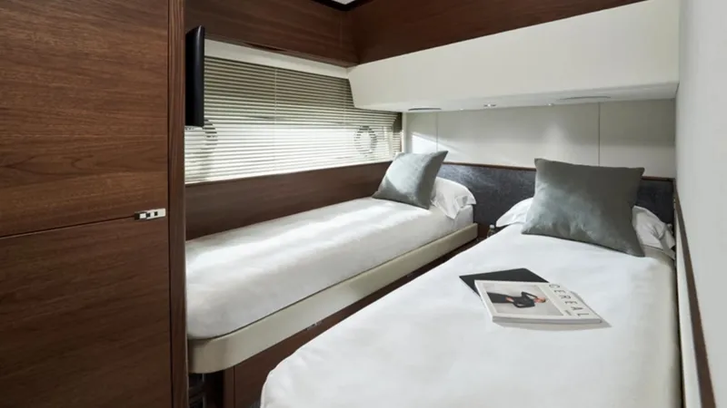 Slide: The Image of Luxurious twin cabin in 2025 Princess F65 yacht with modern decor and comfortable bedding. - 29
