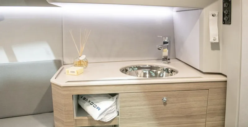 Slide: The Image of 2024 Saxdor 270 GTO interior with modern sink and wooden cabinetry. - 12