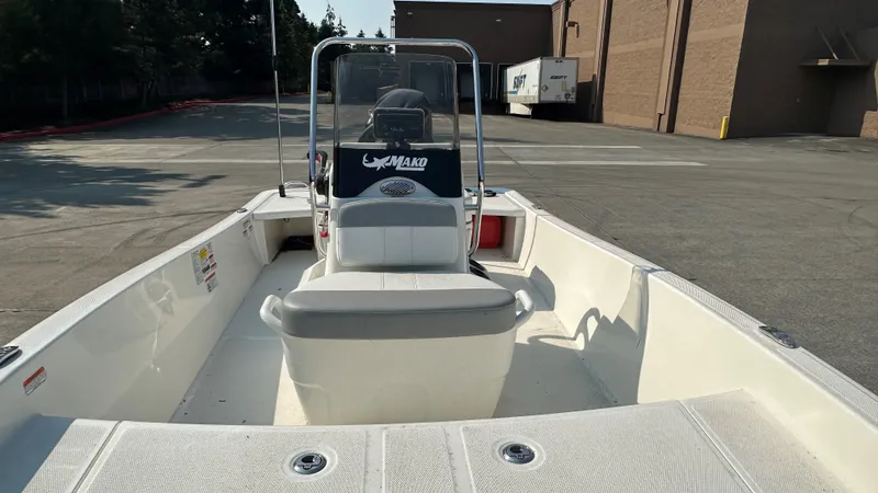 Slide: The Image of 2024 Mako Pro Skiff 15 CC boat in parking lot, front view. - 5