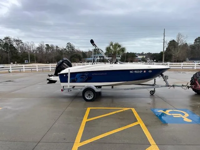 Slide: The Image of 2020 Bayliner Element E16 boat on a trailer in a parking lot. - 3