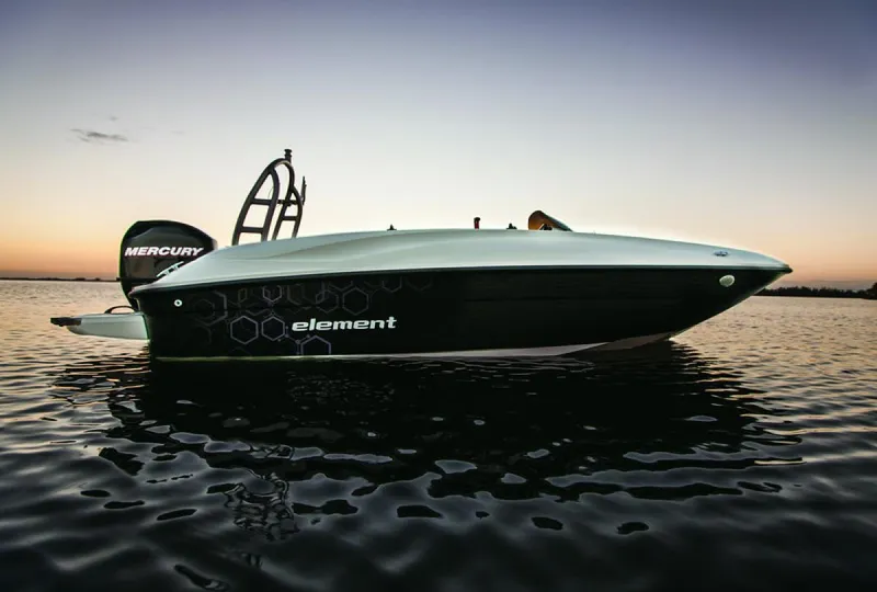 Slide: The Image of 2020 Bayliner Element E16 boat on calm water at sunset. - 10