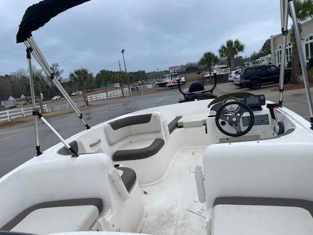 Slide: The Image of 2020 Bayliner Element E16 boat interior with seating and steering wheel. - 4