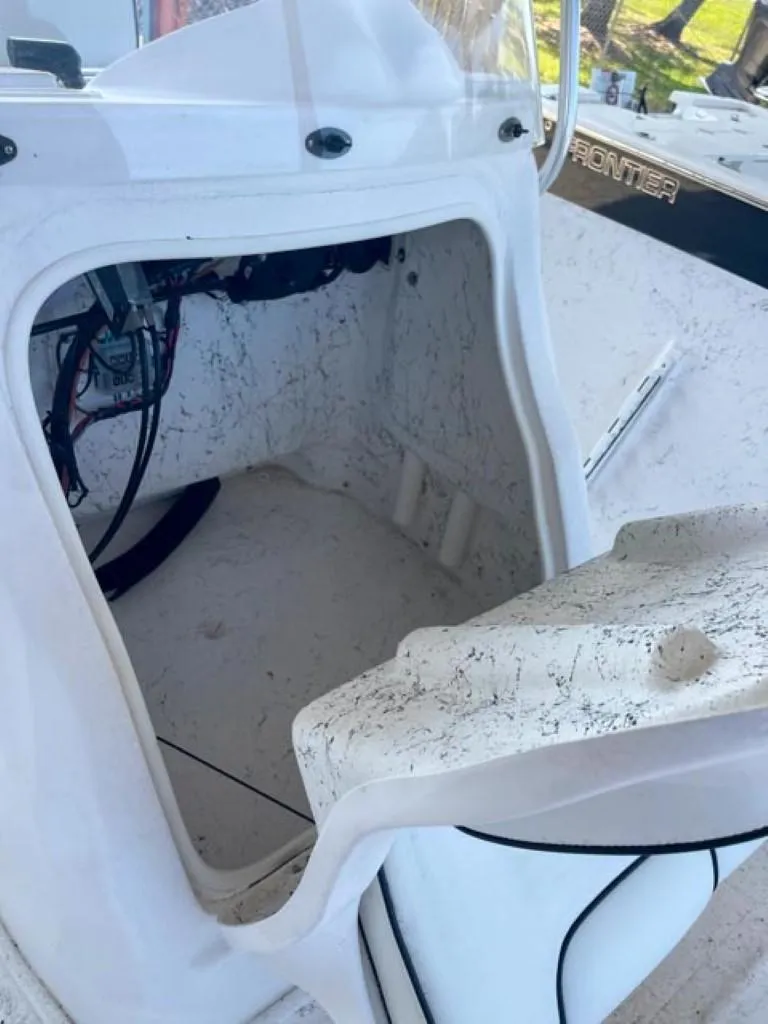Slide: The Image of 2024 ALK2 Powerboats 18 CRS open storage compartment with visible wiring. - 11