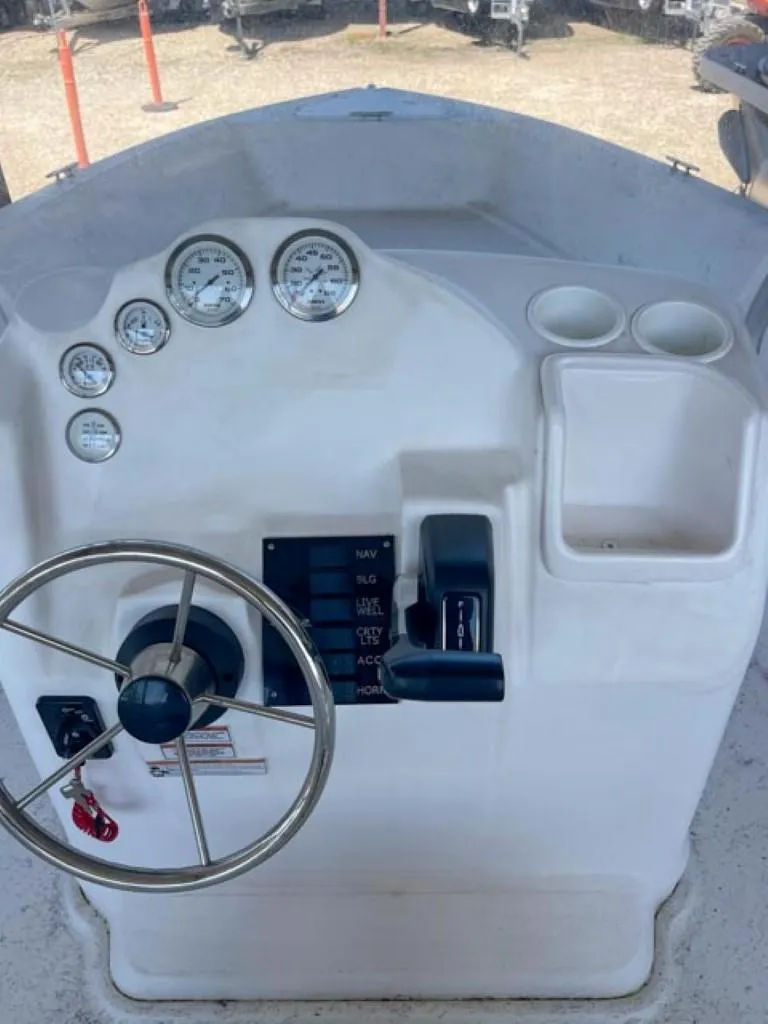 Slide: The Image of 2024 ALK2 Powerboats 18 CRS dashboard with steering wheel and gauges. - 6