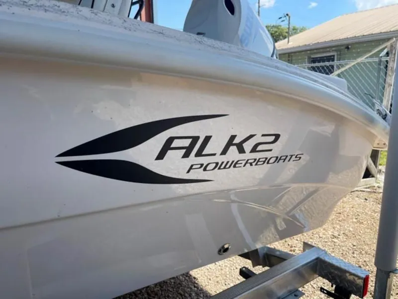 Slide: The Image of 2024 ALK2 Powerboats 18 CRS, white hull with logo, on a trailer. - 8