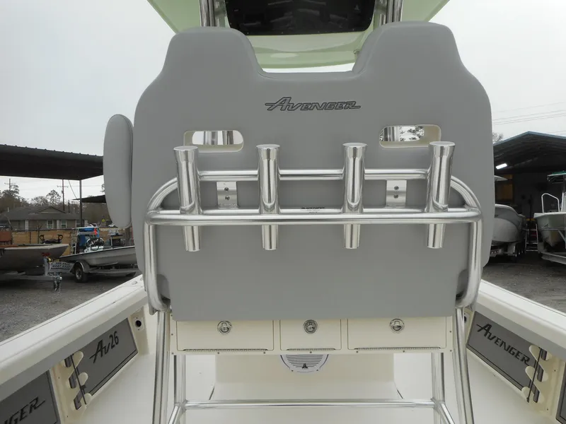 Slide: The Image of 2024 Avenger 26 boat with rod holders and cushioned seating. - 10