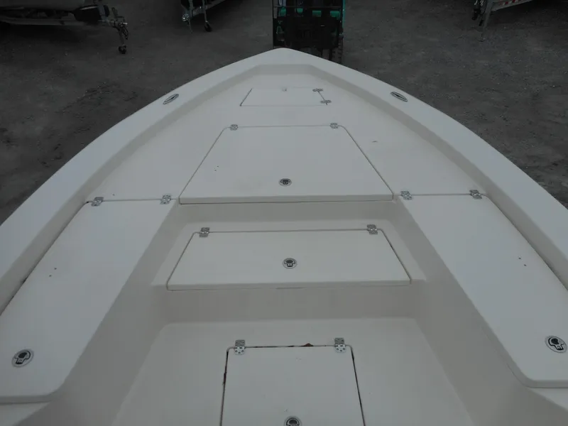 Slide: The Image of 2024 Avenger 26 Avenger boat deck with storage compartments. - 11