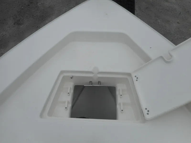 Slide: The Image of 2024 Avenger 26 Avenger boat storage compartment with open hatch. - 13