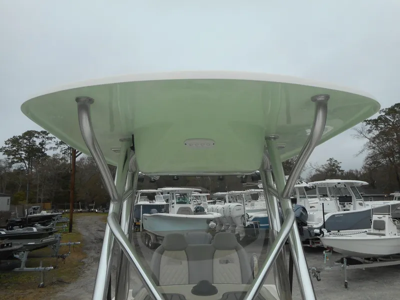 Slide: The Image of 2024 Avenger 26 Avenger boat with T-top in a marina. - 14