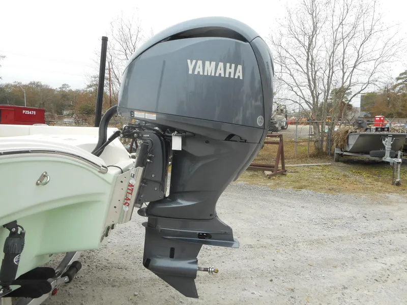 Slide: The Image of 2024 Avenger 26 boat with Yamaha outboard motor. - 17