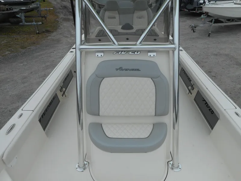 Slide: The Image of 2024 Avenger 26 Avenger boat with cushioned seating and stainless steel frame. - 5