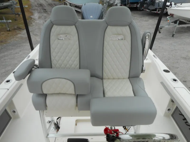 Slide: The Image of 2024 Avenger 26 Avenger boat with dual cushioned seats and armrests. - 6