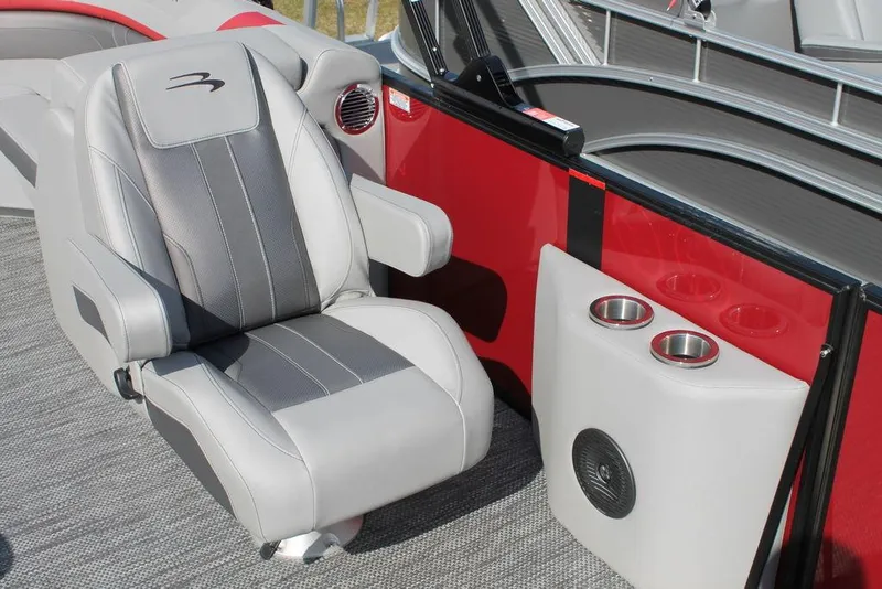 Slide: The Image of 2024 Bennington 23 SXSR boat interior with captain's chair and cup holders. - 10