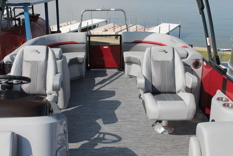 Slide: The Image of 2024 Bennington 23 SXSR pontoon boat interior with gray and red seating. - 3