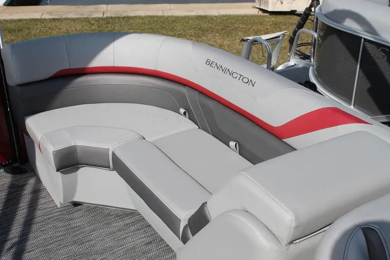 Slide: The Image of 2024 Bennington 23 SXSR boat interior with gray and red seating. - 7