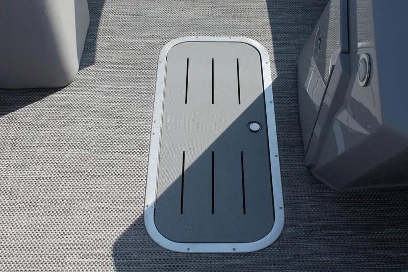 Slide: The Image of 2024 Bennington 23 SXSR boat deck hatch with textured flooring. - 8