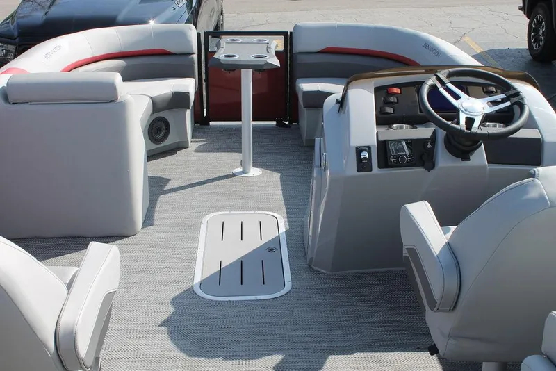 Slide: The Image of 2024 Bennington 23 SXSR pontoon boat interior with gray seating and steering console. - 9