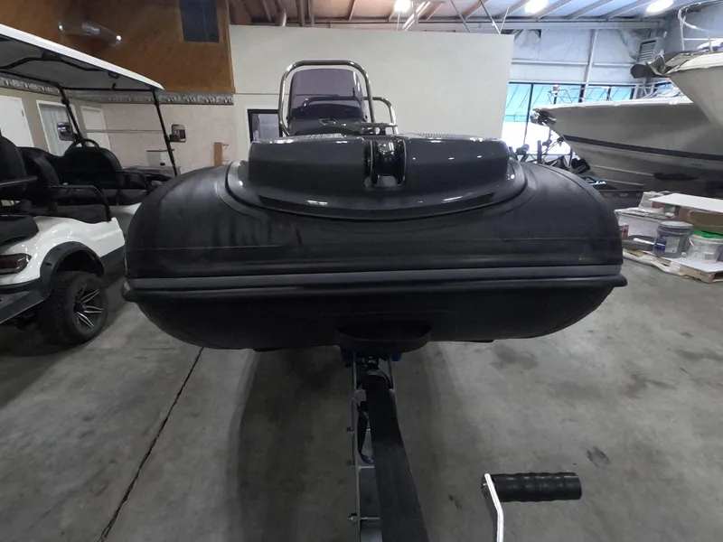 Slide: The Image of 2024 Grand Inflatables S370NL boat in a showroom. - 11