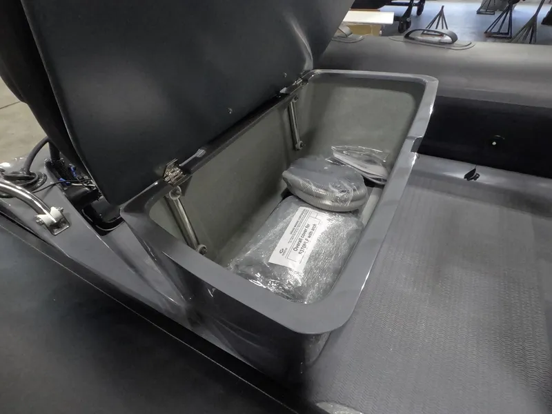 Slide: The Image of 2024 Grand Inflatables S370NL storage compartment with accessories. - 7