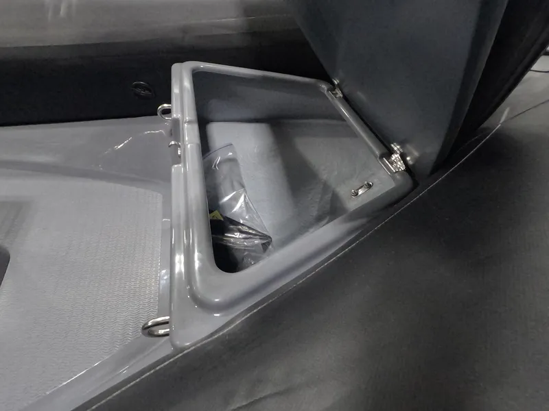 Slide: The Image of 2024 Grand Inflatables S370NL storage compartment with open lid. - 10