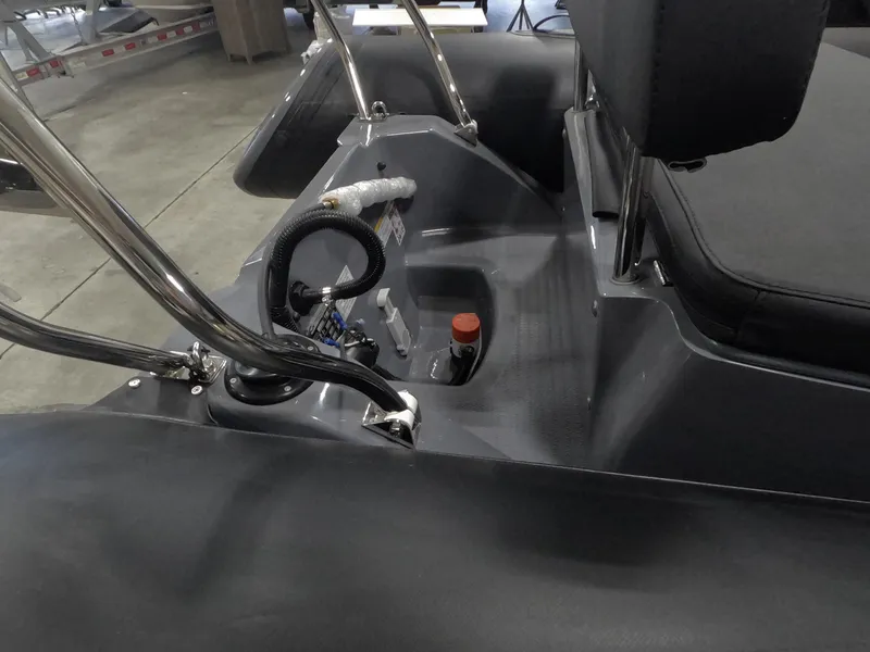 Slide: The Image of 2024 Grand Inflatables S370NL boat interior with control panel and seating. - 5