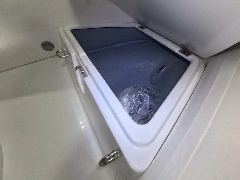 Slide: The Image of Storage compartment of 2024 Grand Inflatables S370NL boat with open lid. - 6