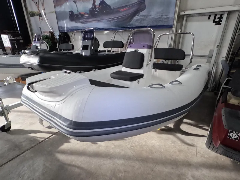 The Image of 2024 Grand Inflatables S370NL boat on display in showroom. - 0
