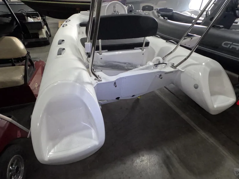 Slide: The Image of 2024 Grand Inflatables S370NL white inflatable boat in showroom. - 11