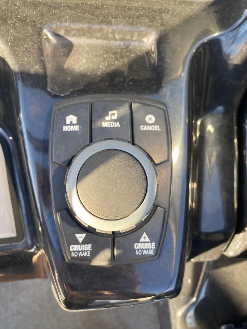 Slide: The Image of Control panel of a 2018 Yamaha Boats AR240 HO with media and cruise buttons. - 10