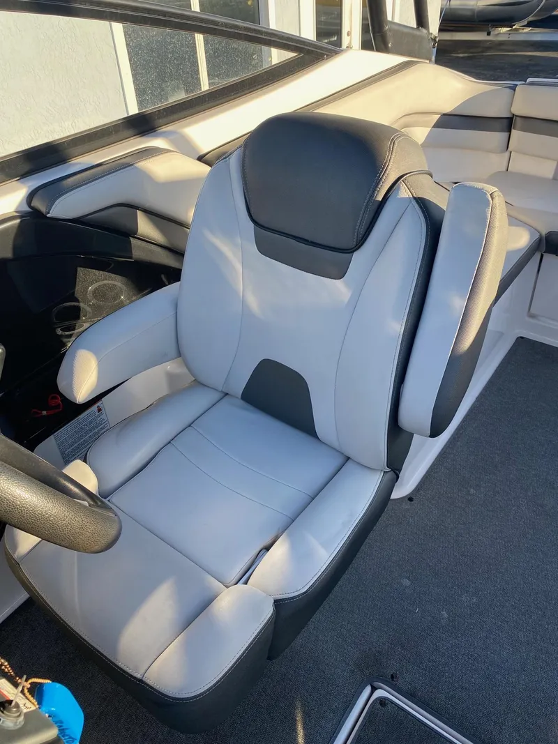 Slide: The Image of 2018 Yamaha Boats AR240 HO captain's chair with gray and black upholstery. - 13
