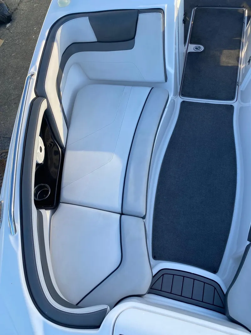 Slide: The Image of 2018 Yamaha Boats AR240 HO interior seating and deck area. - 18