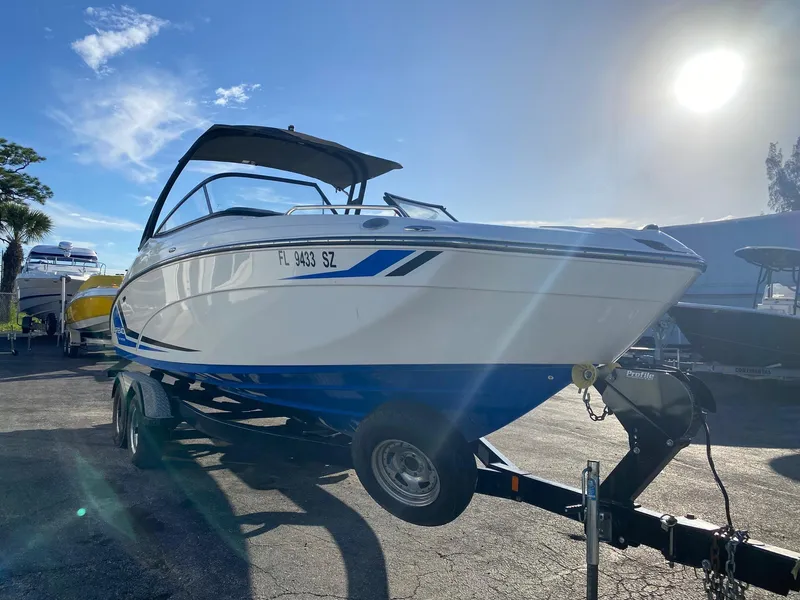 Slide: The Image of 2018 Yamaha Boats AR240 HO on trailer in sunny outdoor setting. - 2