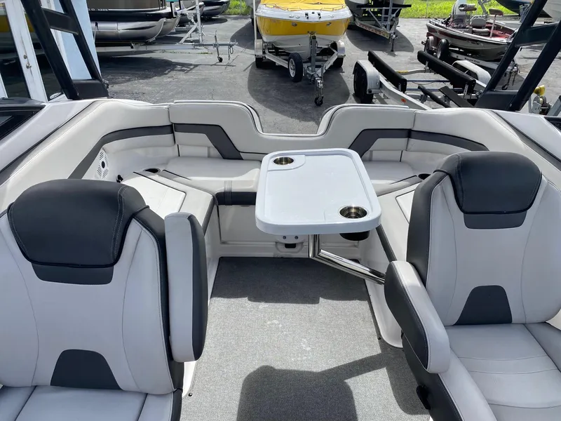 Slide: The Image of 2018 Yamaha Boats AR240 HO interior with seating and table. - 25