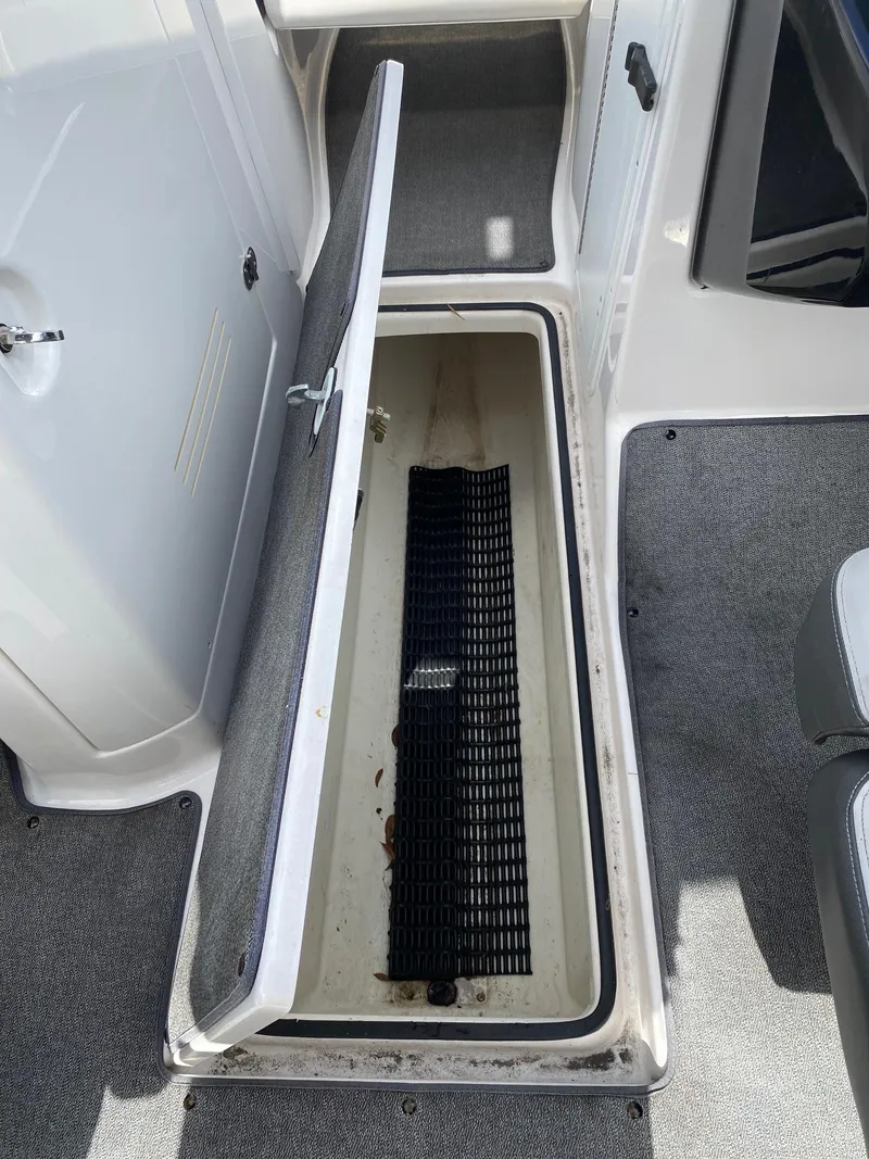 Slide: The Image of Open storage compartment on a 2018 Yamaha Boats AR240 HO. - 26