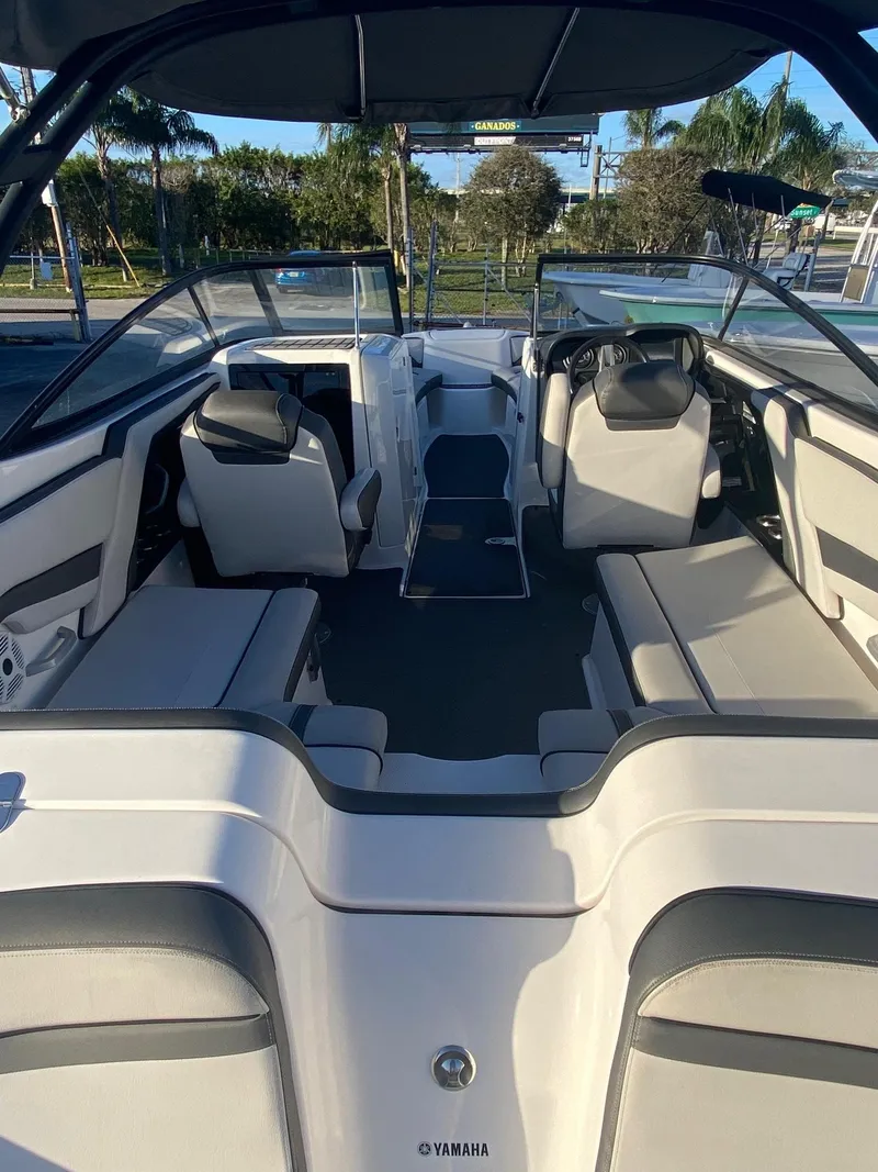 Slide: The Image of 2018 Yamaha Boats AR240 HO interior with seating and steering wheel. - 4