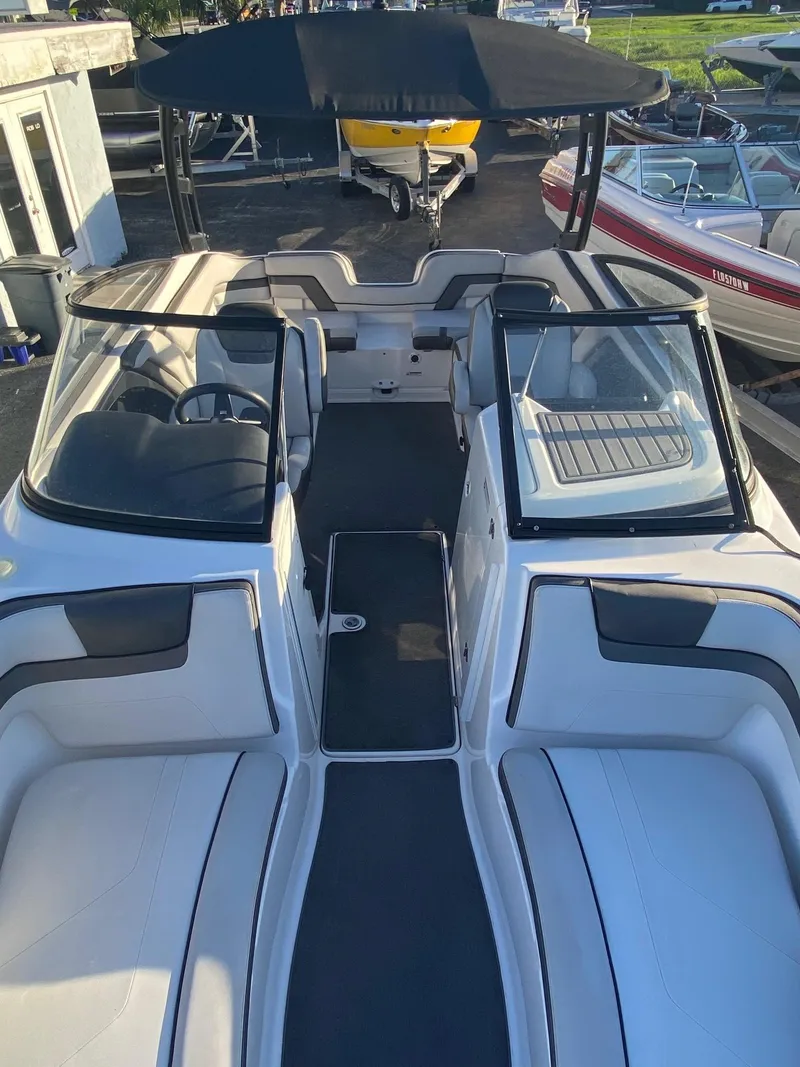 Slide: The Image of 2018 Yamaha Boats AR240 HO interior view with open bow seating and windshield. - 5