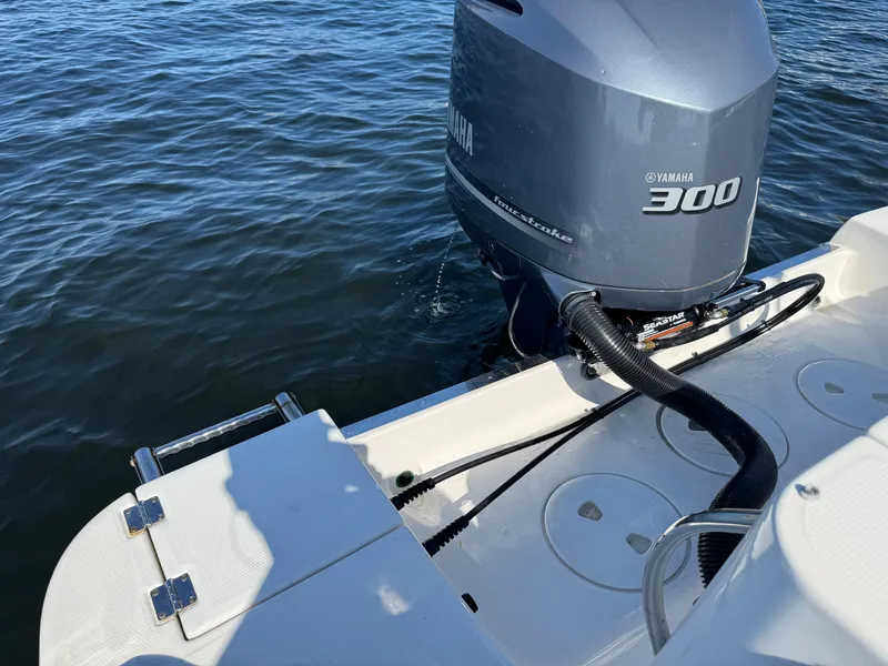 Slide: The Image of 2015 Robalo R247 Dual Console with Yamaha 300 engine on water. - 24