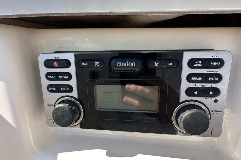 Slide: The Image of Clarion audio system in 2015 Robalo R247 Dual Console boat dashboard. - 33