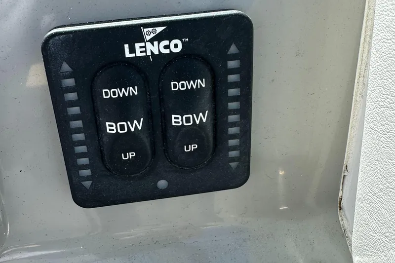 Slide: The Image of Lenco trim tab control panel on 2015 Robalo R247 Dual Console boat. - 34