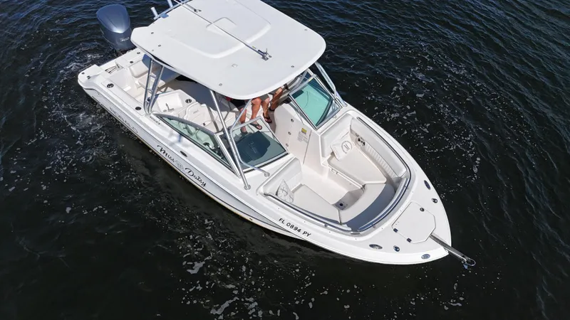 Slide: The Image of 2015 Robalo R247 Dual Console boat on water, aerial view. - 8
