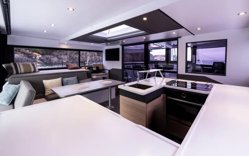 Slide: The Image of Modern interior of 2025 Windelo 50 Adventure yacht with spacious seating and kitchen area. - 20