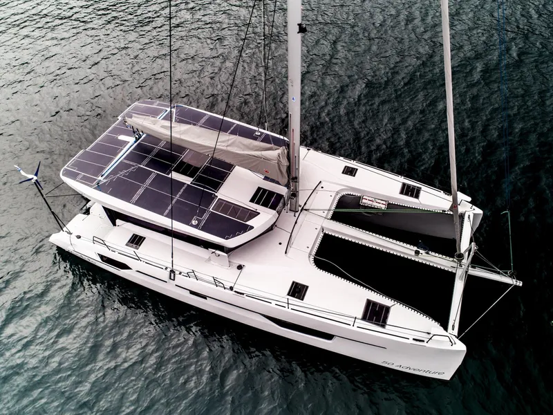 Slide: The Image of Windelo 50 Adventure 2025 catamaran with solar panels on water. - 9