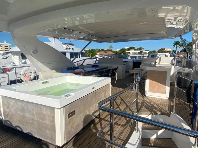 Slide: The Image of Luxurious deck of 2014 Azimut 100 Grande yacht with hot tub and seating area. - 40