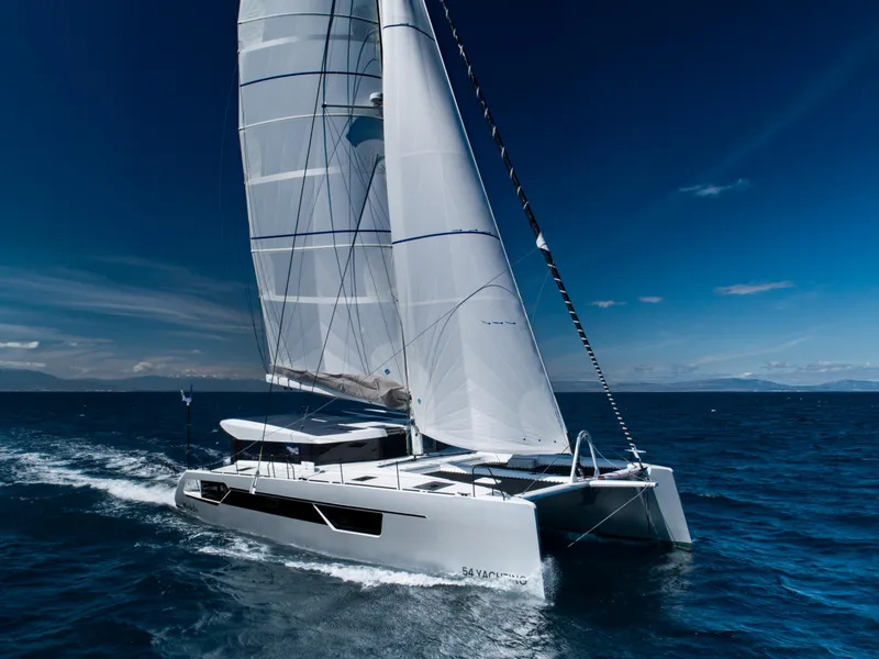 Slide: The Image of Windelo 54 catamaran sailing on open sea, 2025 model. - 18