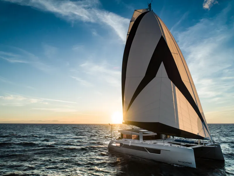Slide: The Image of 2025 Windelo 54 sailboat cruising at sunset on the open sea. - 28