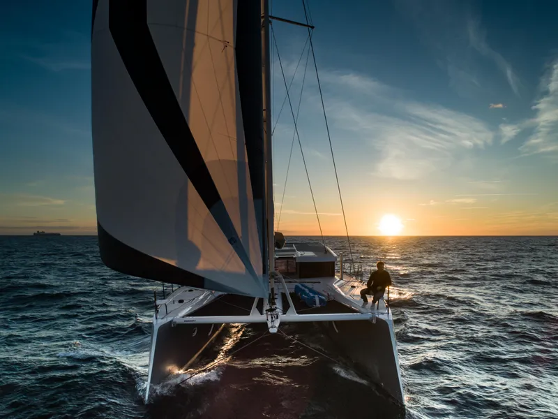 Slide: The Image of Windelo 54 catamaran sailing at sunset, 2025 model. - 29