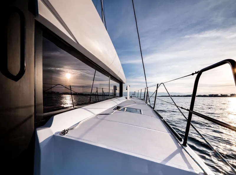 Slide: The Image of Windelo 54 yacht sailing at sunset, 2025 model, sleek deck design. - 33