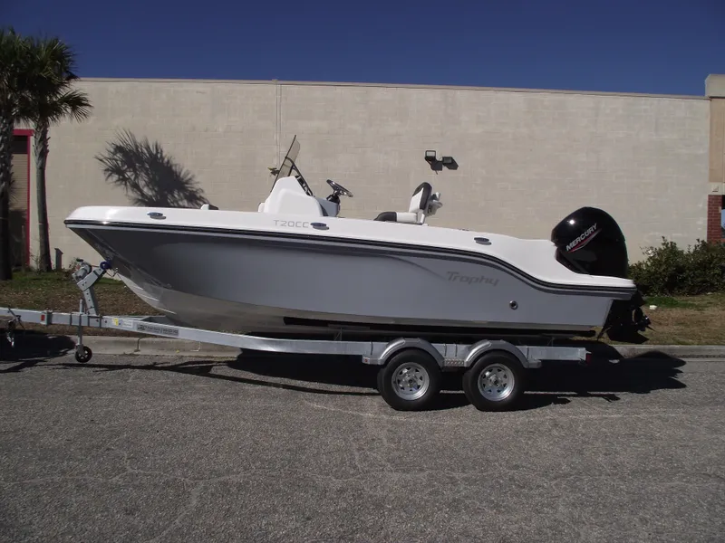 Slide: The Image of 2024 Bayliner CC20 boat on trailer, rear view with outboard motor. - 2