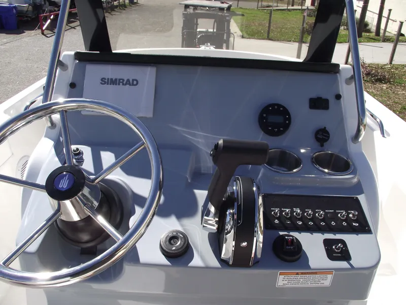 Slide: The Image of Control panel of 2024 Bayliner CC20 boat with audio system and accessory ports. - 21