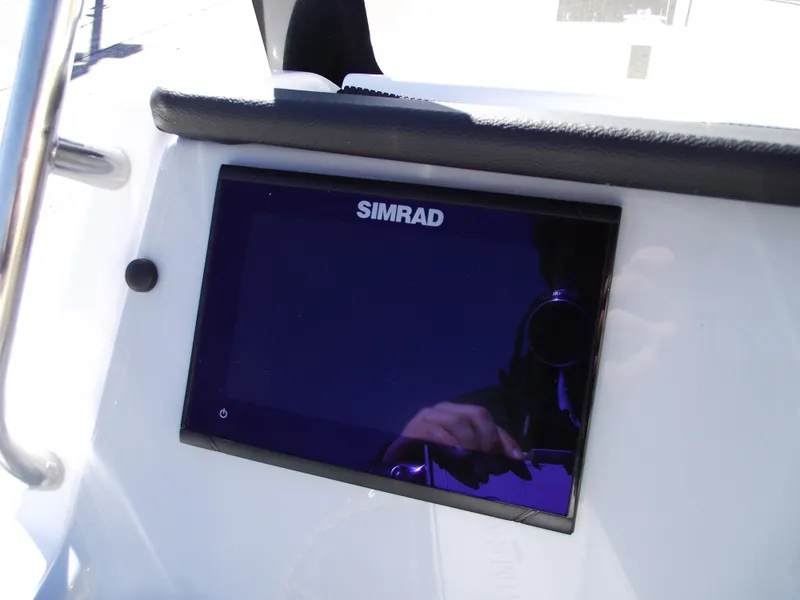 Slide: The Image of Control panel of 2024 Bayliner CC20 boat with various switches and ignition. - 22
